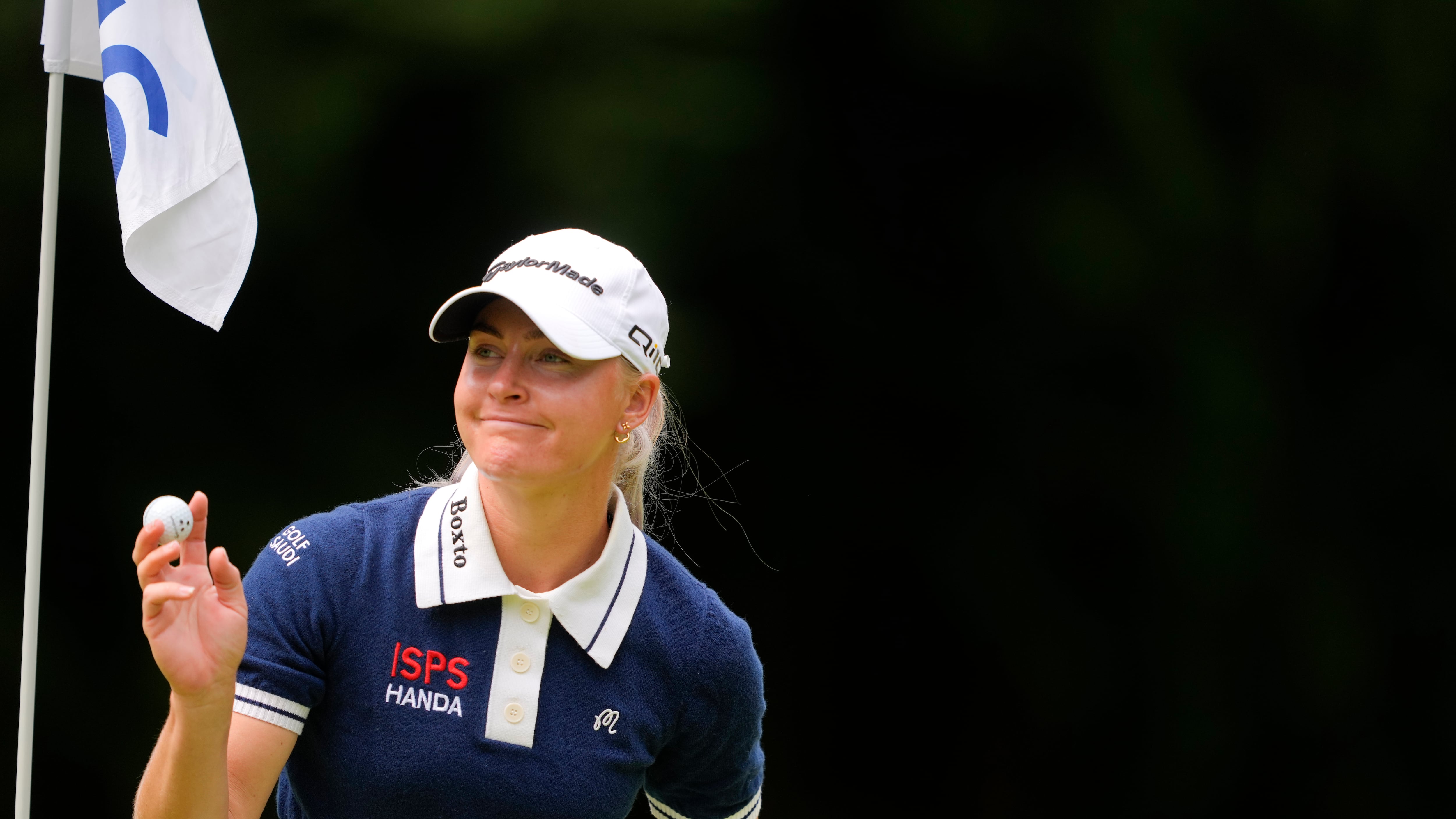 Charley Hull, of England, holds her ball after the 16th hole (Lindsey Wasson/AP)