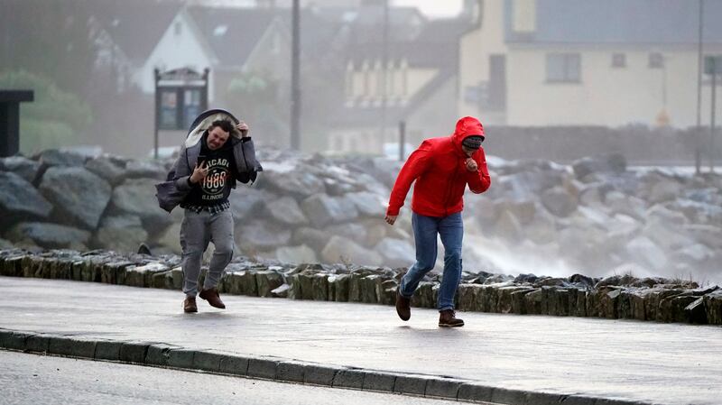 People walk in strong winds in Salthill, Galway during Storm Isha on Sunday, January 21, 2024.Photo by Niall Carson, Pennsylvania.