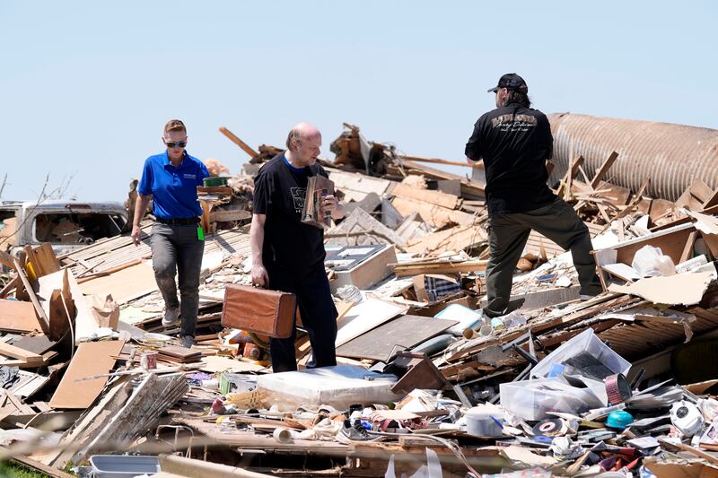 Residents search through debris (Charlie Neibergall/AP)