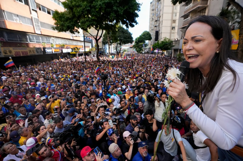 Maria Corina Machado addresses supporters during a protest against President Nicolas Maduro the day before his inauguration (Matias Delacroix/AP)