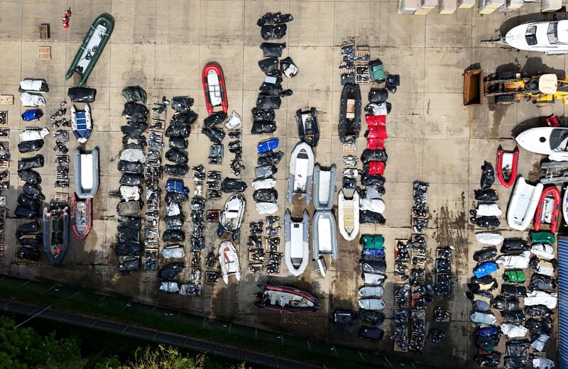 Boats and engines used by migrants to cross the Channel are being stored at a warehouse facility in Dover, Kent