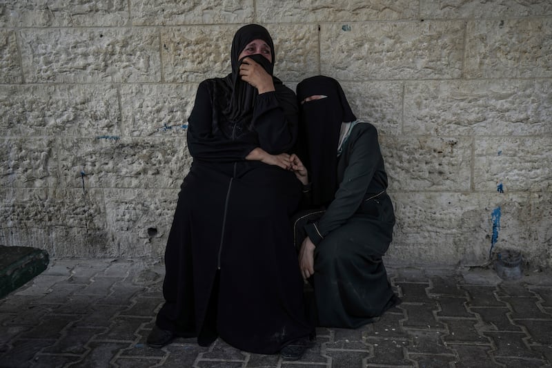 Palestinian women mourn relatives killed in an Israeli bombardment of the Gaza Strip (Abdel Kareem Hana/AP)