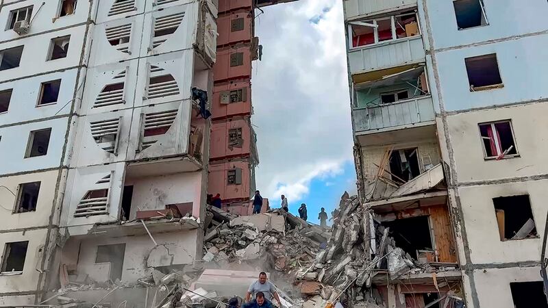 Russian emergency services work at the scene of a partially collapsed block of flats authorities said was hit during an attack by Ukrainian shelling in Belgorod, Russia (Belgorod Region Governor Vyacheslav Gladkov Telegram channel via AP)