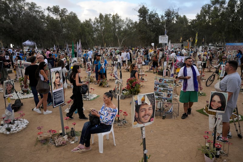 Hundreds of revellers were killed or abducted at the Nova music festival one year ago (AP)