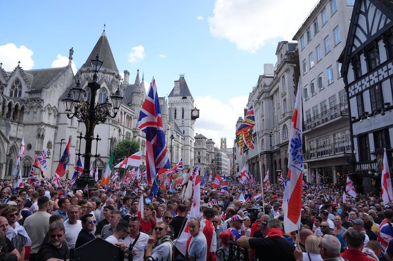 People take part in a protest march in central London organised by Tommy Robinson