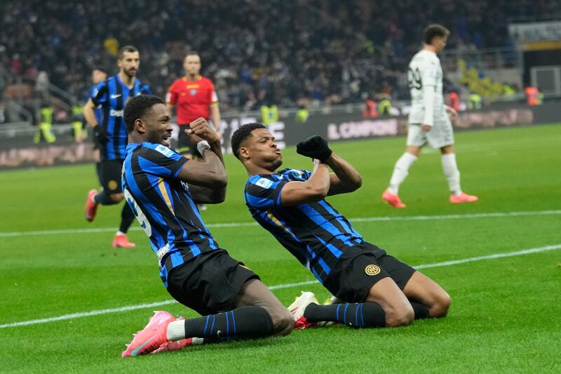 Denzel Dumfries (right) celebrates scoring Inter Milan’s second goal in their 3-1 win over Empoli (Luca Bruno/AP)