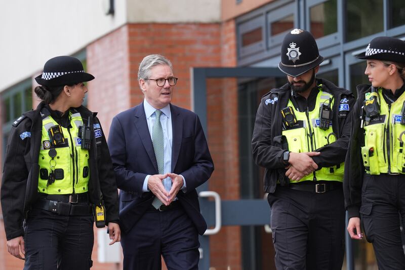 Prime Minister Sir Keir Starmer speaks with members of the West Midlands Police Force at Arden Academy in Solihull, West Midlands