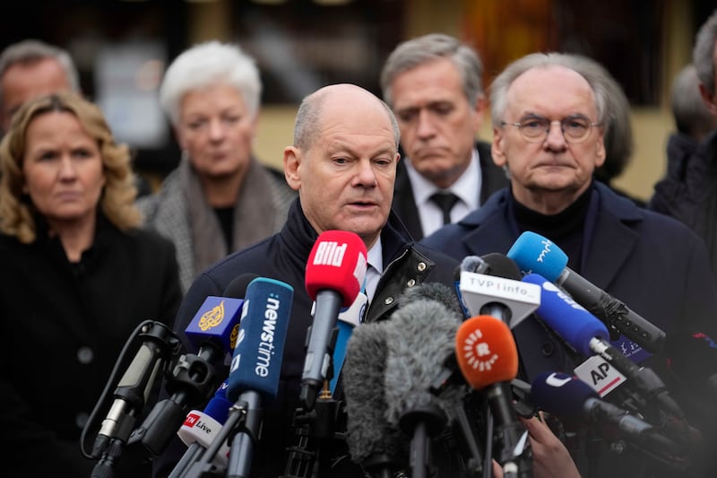 Germany’s Chancellor Olaf Scholz talking to reporters at the Christmas market in Magdeburg on Saturday (AP Photo/Ebrahim Noorozi)