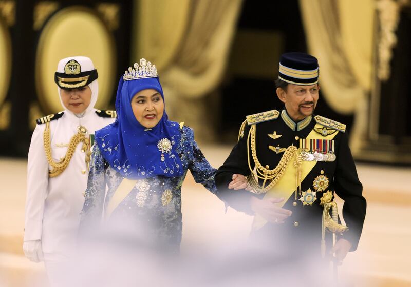 Sultan of Brunei Hassanal Bolkiah and Queen of Brunei Pengiran Anak Saleha attended the coronation at the National Palace in Kuala Lumpur (Pool via AP)