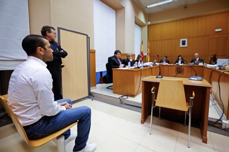 Footballer Dani Alves sits during his trial in Barcelona earlier this month