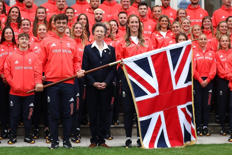 Anne stands between British team flag bearers Helen Glover and Tom Daley and other team members ahead of the 2024 Olympic Games in Paris