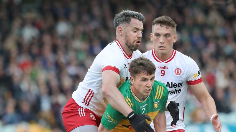 Mattie Donnelly tackles Donegal's Peadar Mogan as Conn Kilpatrick looks on during Donegal's All-Ireland SFC Group Three win over Tyrone.