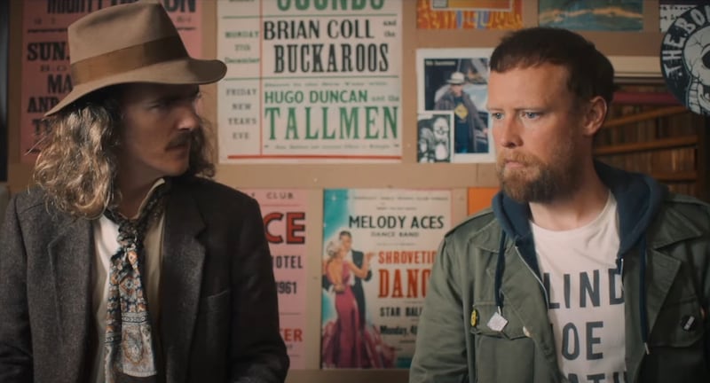 Dermott (Brenock O'Connor) and Elvis (Owen Colgan) behind the counter at The Boneyard