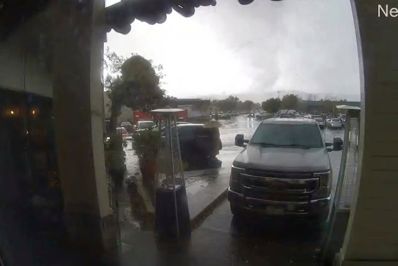 This image made from a video provided by Bruno’s Bar and Grill shows a tornado descending on Scotts Valley, California (Bruno’s Bar and Grill via AP)