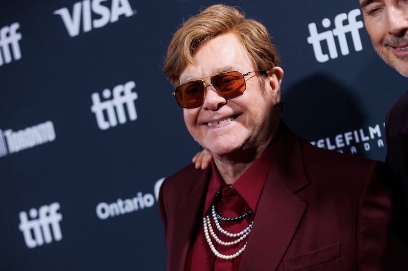 Sir Elton John arrives on the red carpet for the premiere of Elton John: Never Too Late (Cole Burston/The Canadian Press via AP)