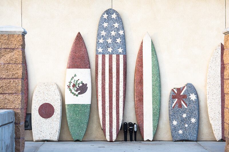 Surfboards lined up at Huntington Beach