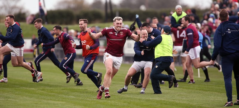 Ryan McCambridge leads the celebrations at the final whistle after Cushendall retain the Volunteer Cup at Dunloy's expense. Picture: Seamus Loughran