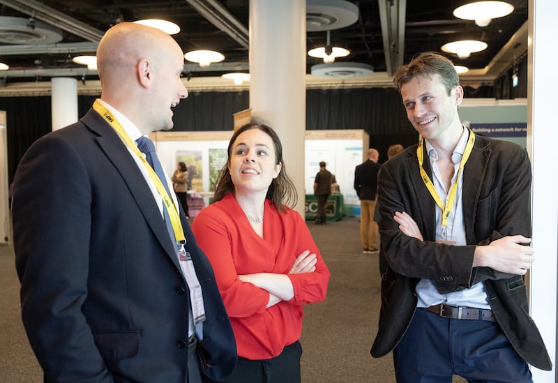 Deputy First Minister Kate Forbes (centre) and Stephen Flynn (left) visit the exhibitors’ hall during the SNP conference