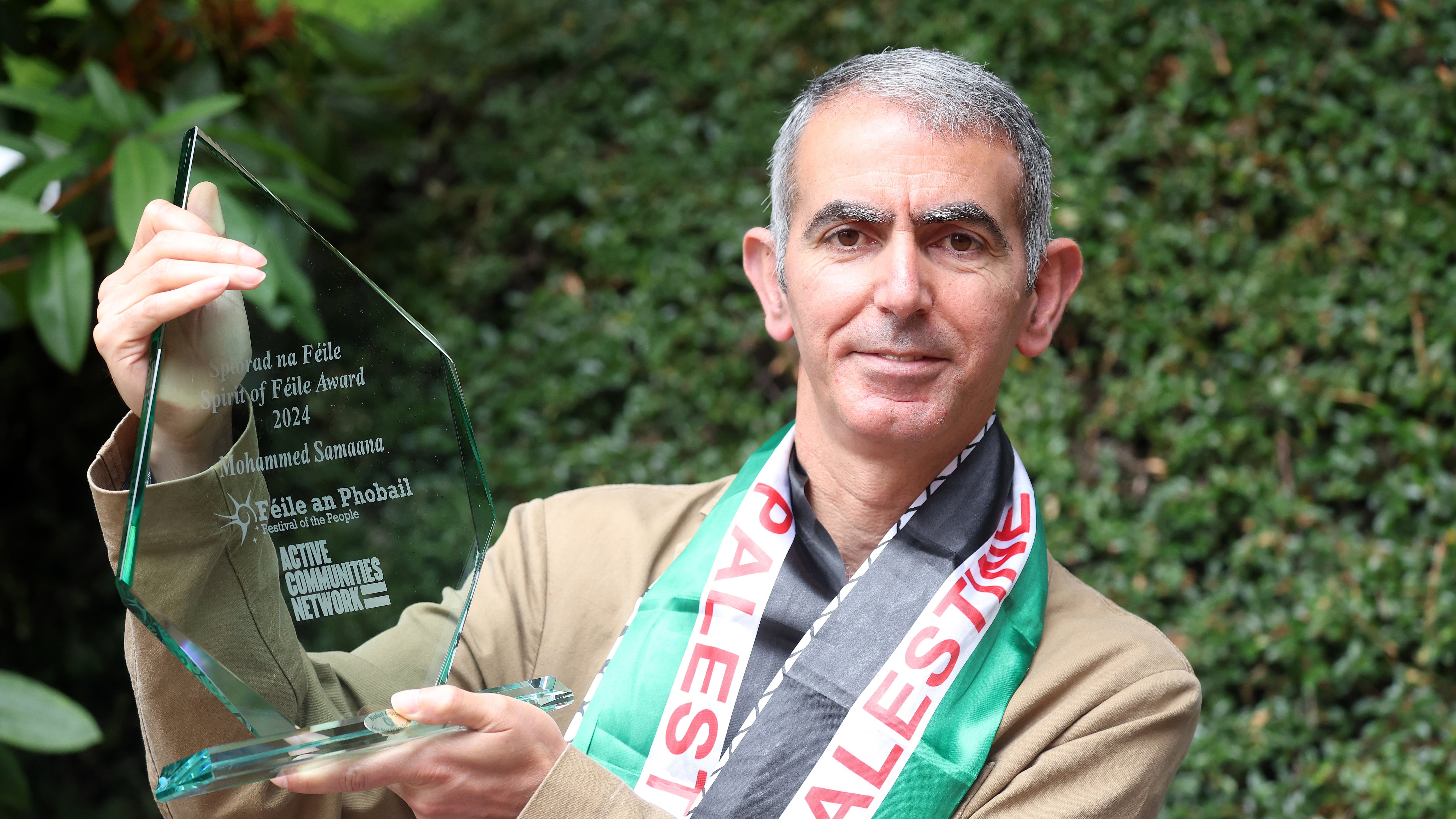 Palestinian born Mohammed Samaana who lives and works in Belfast and campaigns on behalf of the Palestinian people  receives the Spirit of Feile award at the launch of Feile an Phobail in St Marys College. PICTURE: MAL MCCANN