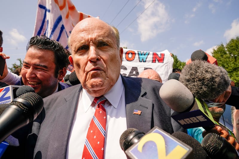 Rudy Giuliani speaks outside the Fulton County jail in Atlanta (AP)