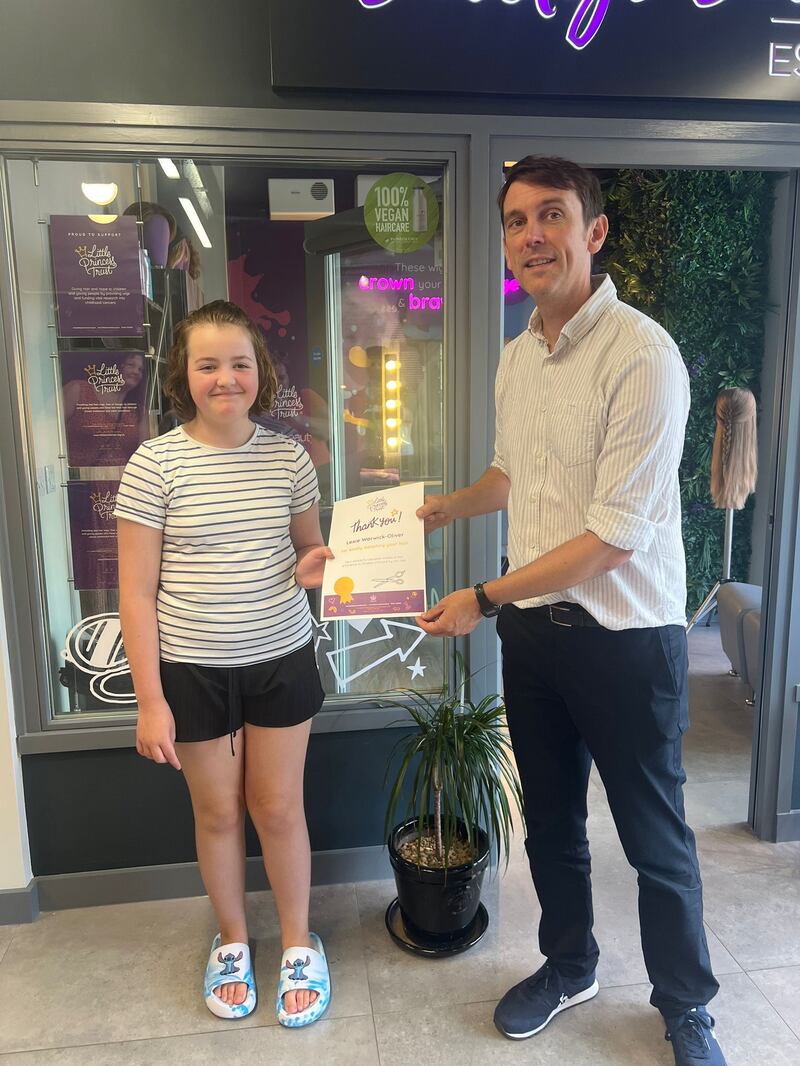 Lexie received a certificate from the charity
