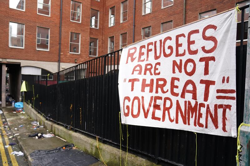 A banner at a site used by asylum seekers at the International Protection Office on Mount Street, Dublin