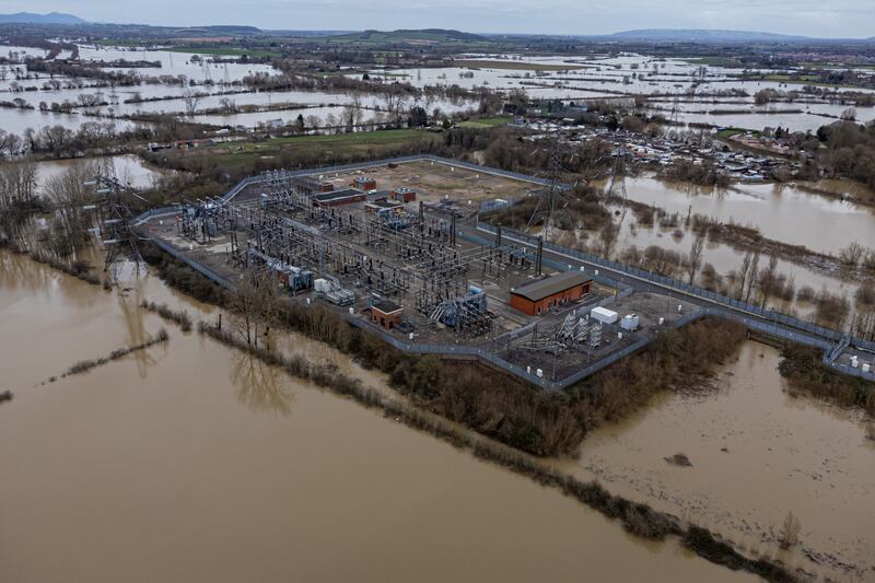 Flood water surrounds a power grid sub-station in Gloucester