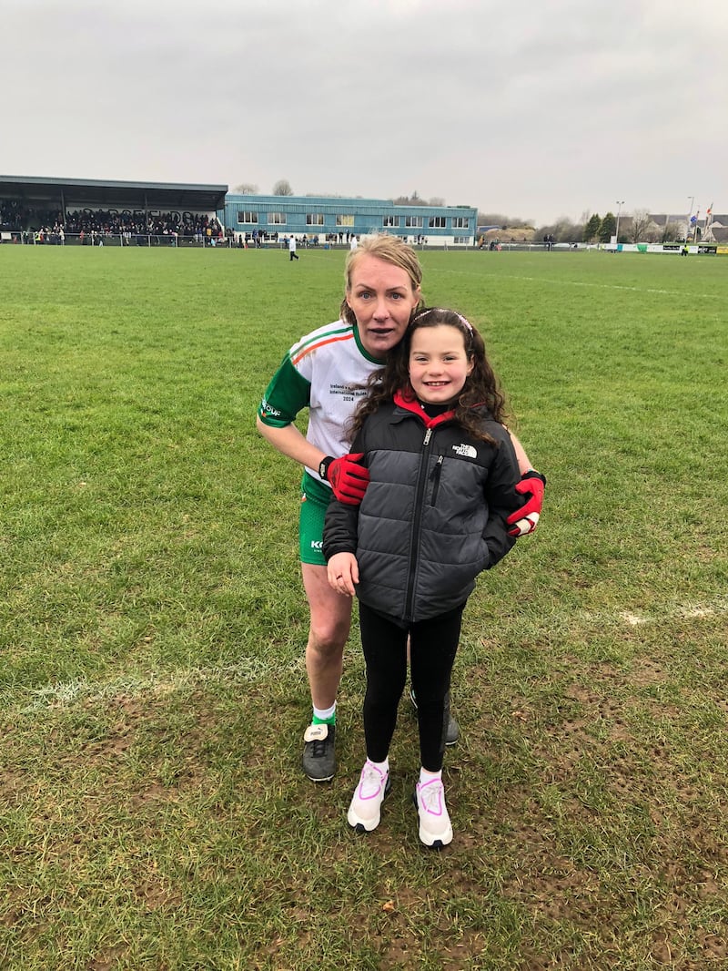 Michaela Downey with her niece, Caoimhe, after Ireland's win over Australia in Charlestown on Saturday afternoon