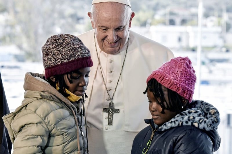 At the start of this month, Pope Francis visited Greece, in a trip which drew attention to the plight of migrants and refugees fleeing terrible situations for a better future and the hope of work - an essential source of dignity and peace, argues the Pope in his peace day message. The Pope is pictured greeting children during a ceremony at the Karatepe refugee camp, on the Aegean island of Lesbos; he criticised the indifference and self-interest shown by Europe &quot;that condemns to death those on the fringes&quot;. Picture by Louisa Gouliamaki/Pool via AP. 