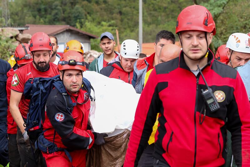 Members of the mountain rescue service carry the body of a victim of a landslide in Donja Jablanica in southern Bosnia (Armin Durgut/AP)