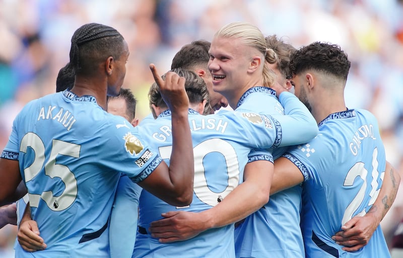 Erling Haaland, centre right, celebrates with team-mates after completing his hat-trick against Ipswich