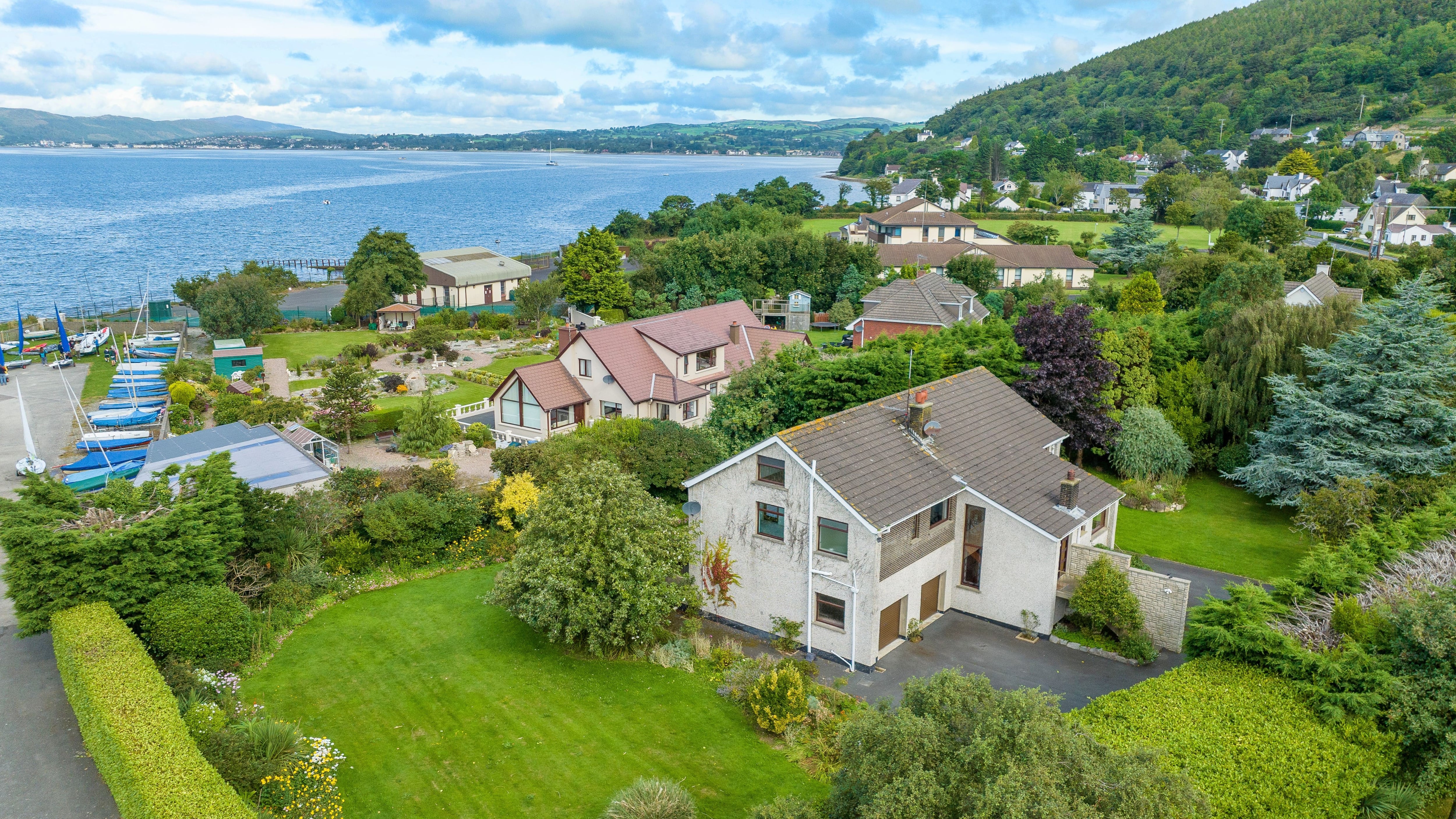 The scenic setting of Rostrevor. For sale is 33 Killowen Village, BT34 – offered at bids over £495,950 and for sale by Best Property Services.
The well located five-bed detached residence in a highly desirable area boasts panoramic 360-degree views, with the majestic Mourne Mountains as a stunning backdrop