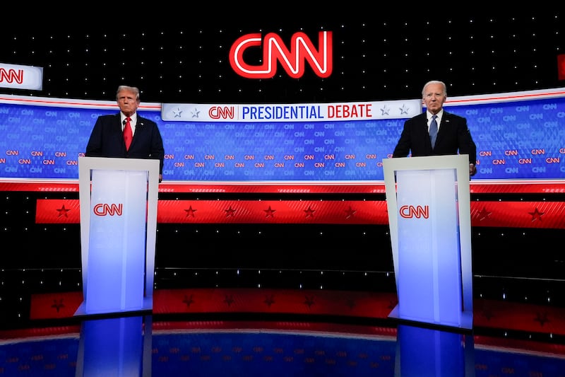 President Joe Biden, right, and Republican presidential candidate former president Donald Trump, left, stand during a break in the presidential debate hosted by CNN (John Bazemore/AP)