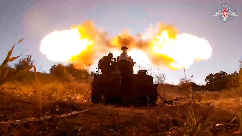 Russian soldiers fire a tank gun towards Ukrainian positions at an undisclosed location in the Kursk region (Russian Defence Ministry press service/AP)