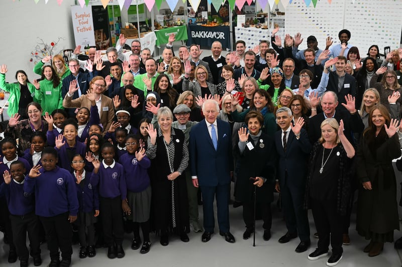 Charles and London Mayor Sadiq Khan pose for a group photo at the Coronation Food Project hub in Deptford, south-east London