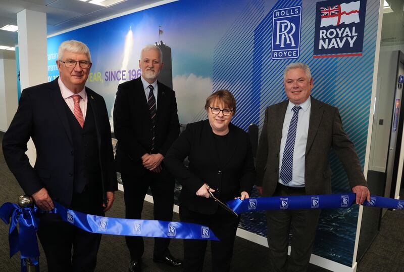 Defence minister Maria Eagle cuts a ribbon to open the office, alongside Vice-Admiral Sir Chris Gardner, far left, Commander Paul Dunn, left, and Steve Carlier of Rolls-Royce Submarines, right