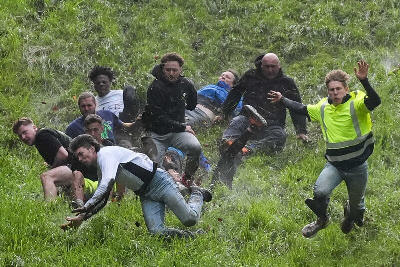 Participants risk life and limb as they race down Cooper’s Hill after an 8lb double Gloucester cheese