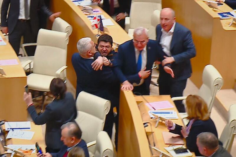 This photo taken from video shows Georgian legislators fighting during a parliament session in Tbilisi (Mtavari Channel/AP)