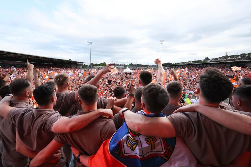 Armagh celebrate  with the fans at the Athletic grounds in Armagh on Monday, after winning the All Ireland.
PICTURE COLM LENAGHAN