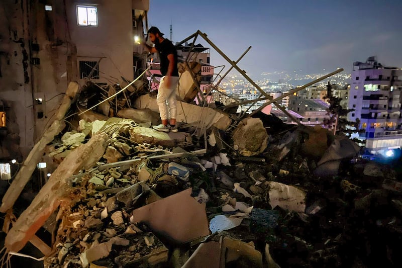 A man inspects a destroyed building that was hit by an Israeli airstrike in the southern suburbs of Beirut, Lebanon (Hussein Malla/AP)