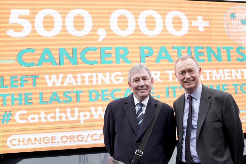 Former England football captain Bryan Robson (left) with ex-Liberal Democrat leader Tim Farron during a World Cancer Day event in London