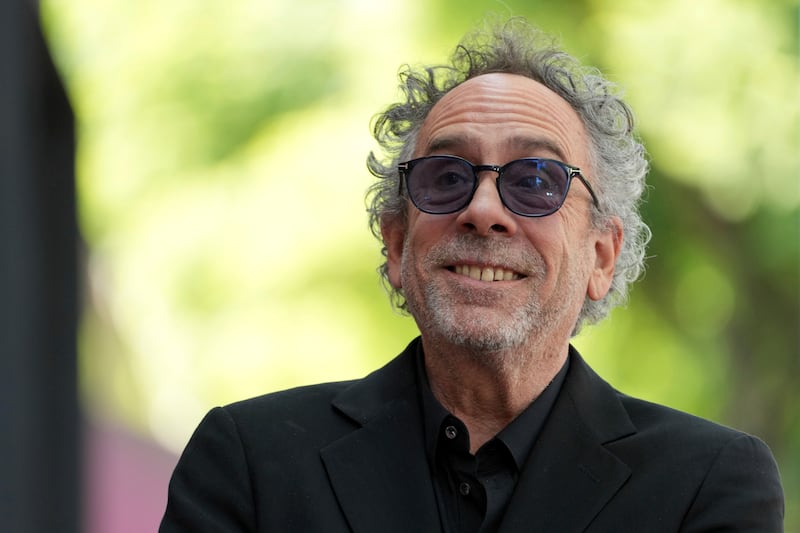 Tim Burton arrives at a ceremony honouring him with a star on the Hollywood Walk of Fame (Jordan Strauss/Invision/AP)