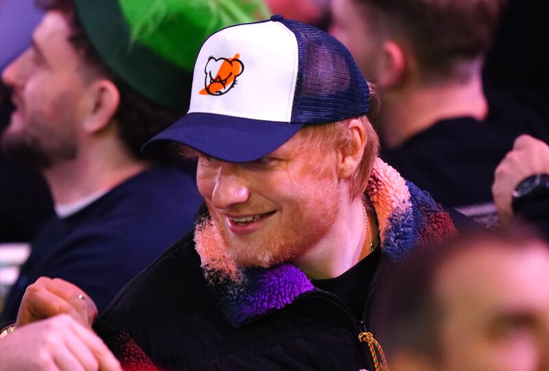 Singer songwriter Ed Sheeran watches the action