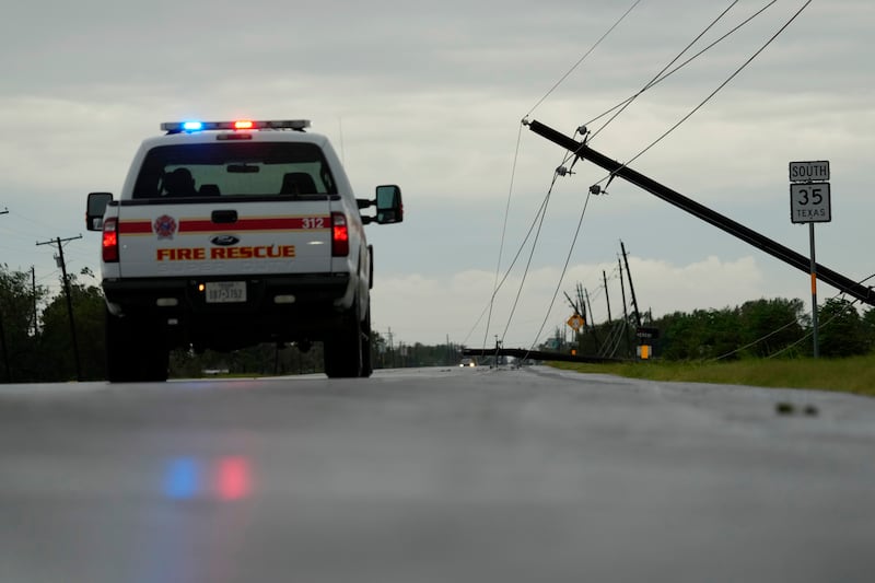 Power lines downed by the effects of Hurricane Beryl block a highway near Palacios, Texas (Eric Gay/AP)