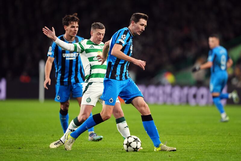 Club Brugge’s Hans Vanaken and Celtic’s Callum McGregor compete for the ball