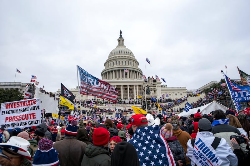 People attack the US Capitol in Washington on January 6 2021 (AP/Jose Luis Magana)