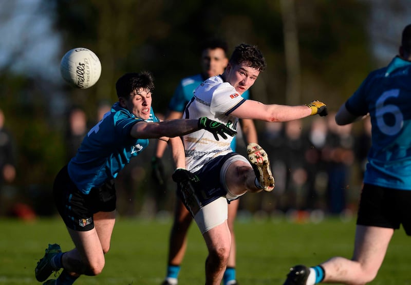 Sigerson Cup quafrter final at UUJ 29/01/2025.  Ulster University's Daniel Fulerton drops a ball into the area while under pressure from Maynooth's Brian O'Halloran during the game.  Picture Mark Marlow