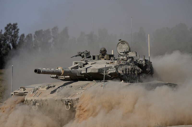 An Israeli tank near the Israel-Gaza border (Tsafrir Abayov/AP)