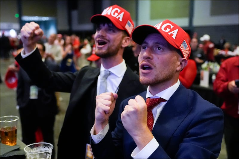 Donald Trump supporters have been cheering victories in Georgia and North Carolina (Julia Demaree Nikhinson/AP)