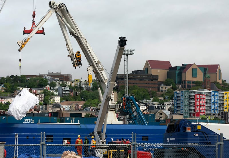 Debris from the Titan submersible recovered from the ocean floor near the wreck of the Titanic is unloaded from the ship Horizon Arctic (Paul Daly/AP)